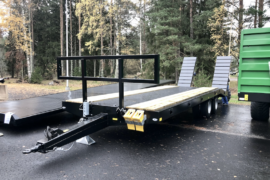bale holder for machinery trailer