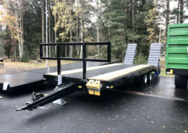 bale holder for machinery trailer